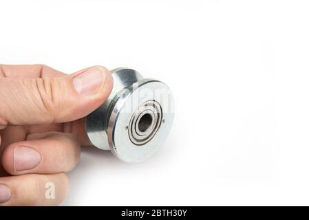 Heavy duty sliding wheel on bearings on a white Stock Photo