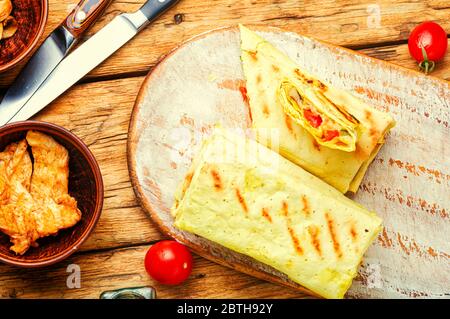 Traditional eastern shawarma with chicken,cheese and mushrooms Stock Photo