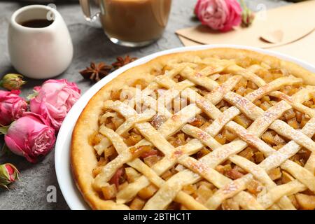 Composition with apple pie on gray background. Homemade food Stock Photo