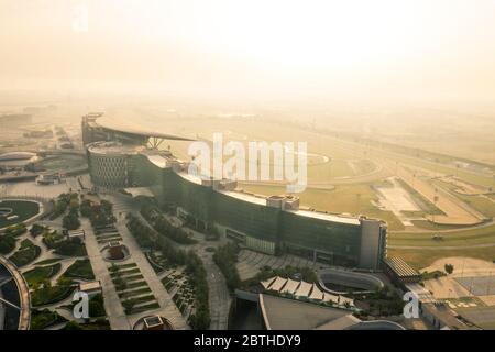 Aerial view of the green Meydan racecourse with UAE map in the middle ...