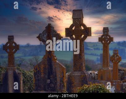 Christ Church (Church of Ireland), Kilmeen, Rossmore, County Cork, Republic of Ireland. Eire.  Celtic crosses in the graveyard. Stock Photo