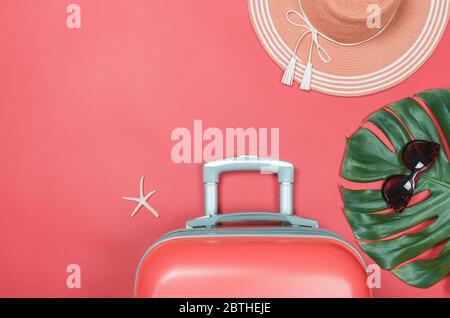 Summer straw hat, travel bag starfish and sunglasses on a bright background. flatlay Stock Photo