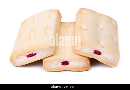 Group of pastry cookies with cream and jam filling isolated over white background Stock Photo