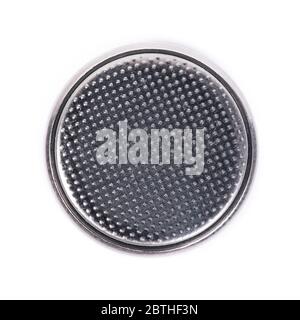 Flat lithium round button cell battery isolated over white background Stock Photo