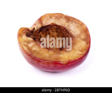 Half of rotten nectarine isolated on white background Stock Photo