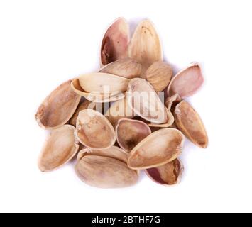 Heap of empty pistachios shells isolated on white background Stock Photo