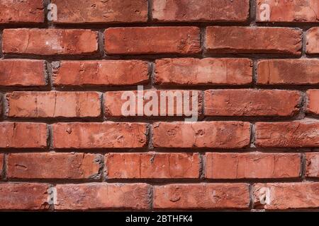 old red brick brick wall with glare from the sun Stock Photo
