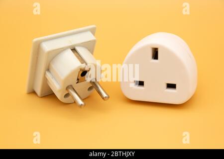 Travel adapters used for accessing electricity during international travel. The adapters enable accessories to charge from wall sockets. Stock Photo