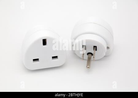 Travel adapters used for accessing electricity during international travel. The adapters enable accessories to charge from wall sockets. Stock Photo
