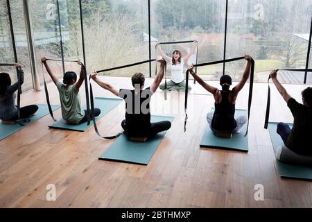 Yoga class at Avalon Wellbeing Centre in the grounds of Broughton Hall near Skipton, North Yorkshire, UK. 23/11/2019. Photograph: Stuart Boulton. Stock Photo