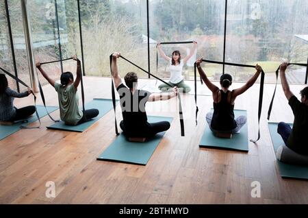 Yoga class at Avalon Wellbeing Centre in the grounds of Broughton Hall near Skipton, North Yorkshire, UK. 23/11/2019. Photograph: Stuart Boulton. Stock Photo