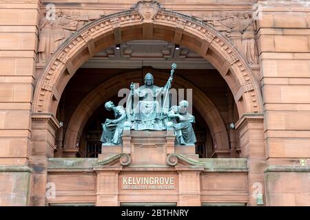 The bronze statue of St Mungo as the Patron of Art and Music above the entrance to Kelvingrove Art Gallery and Museum in Glasgow, Scotland. Stock Photo