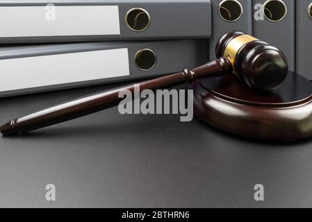 close-up of judges gavel and file folders with copy space on labels on table Stock Photo