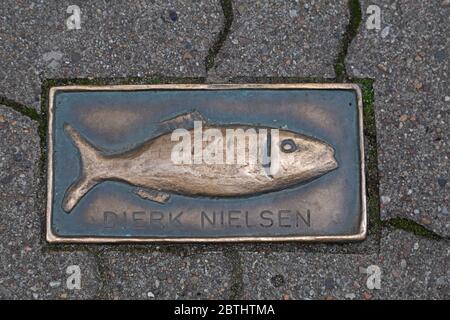 bronze fish plate in the pavement, Kappeln, Baltic Sea Fiord Schlei, Schleswig-Holstein, Germany Stock Photo