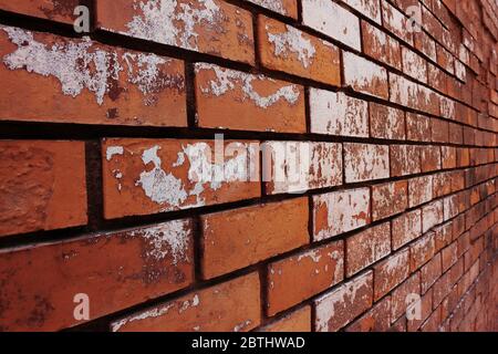 Old brick wall of red color, in perspective Stock Photo