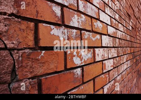 Old brick wall of red color, in perspective Stock Photo