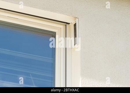 indirect ventilation system installed in the window of a new house Stock Photo