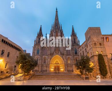 Barcelona - The facade of old gothic cathedral of the Holy Cross and Saint Eulalia at dusk. Stock Photo