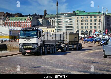 Customised Renault Trucks C of Sorakeisari Oy pulls gravel trailer in city traffic on a beautiful day near Kauppatori, Helsinki, Finland. May 26, 2020 Stock Photo