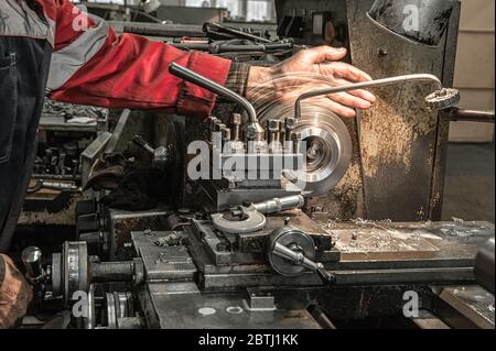 Master's hand. The old Metalworking machine, manufactured in the middle of the last century, is still in good condition. The use of old technologies i Stock Photo