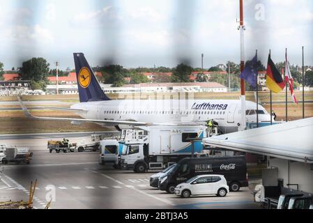 Berlin, Germany. 26th May, 2020. A plane of Lufthansa is seen at the Berlin Tegel Airport in Berlin, capital of Germany, May 26, 2020. German flag carrier Deutsche Lufthansa AG said on Monday that the federal government's Economic Stabilization Fund (WSF) has approved a nine-billion-euro rescue package (9.8 billion U.S. dollars) for the company. Credit: Shan Yuqi/Xinhua/Alamy Live News Stock Photo