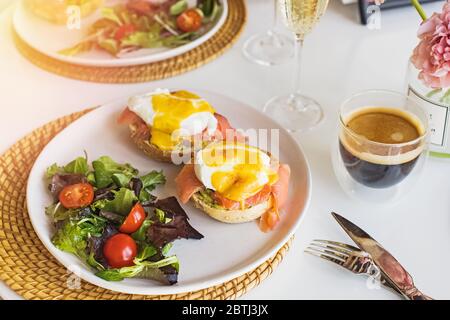 Sunday brunch with eggs benedict, salad and coffee Stock Photo