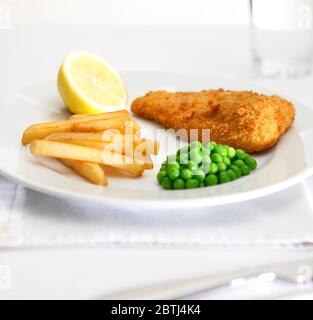 Bread crumbed fish and chips Stock Photo