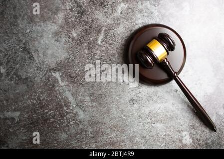 directly above view of judges gavel on marble stone table background