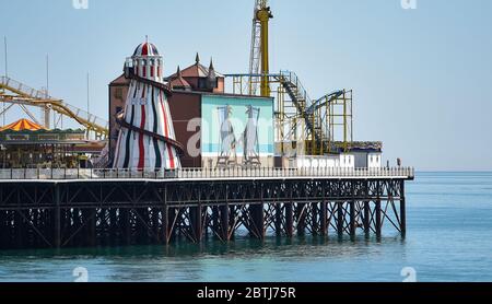 Brighton UK 26th May 2020 - A giant deck chair and seagull mural on the side of Brighton Palace Pier today as the hot sunny weather continues during the Coronavirus COVID-19 pandemic crisis  . Credit: Simon Dack / Alamy Live News Stock Photo