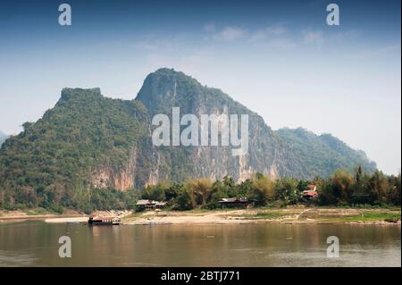 A view over Mekong River to the mountains of  Pak Ou, Northern Laos, Southeast Asia Stock Photo