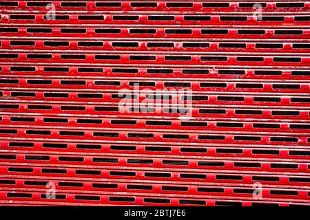 Rusty,red peeling building shutters background. Stock Photo