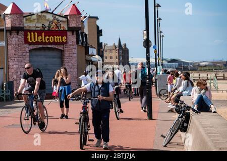 Portobello, Scotland, UK. 26 May 2020. Portobello beach and promenade were relatively quiet despite sunny warm weather. Police patrols on foot were low key and officers were not asking many members of the public to move on.  Iain Masterton/Alamy Live News Stock Photo