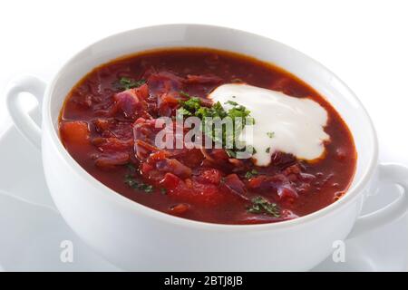 Traditional Ukrainian Russian borsch. Beetroot soup isolated on white background. Close up Stock Photo