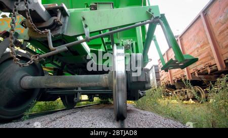 View underneath the wagon on cargo train car on industrial railroad Stock Photo