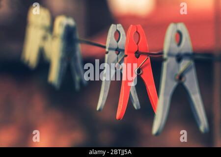 Colorful Plastic Clothespin or Clothes Peg on a Rope Used to Hang Up Drying Clothes. Stock Photo