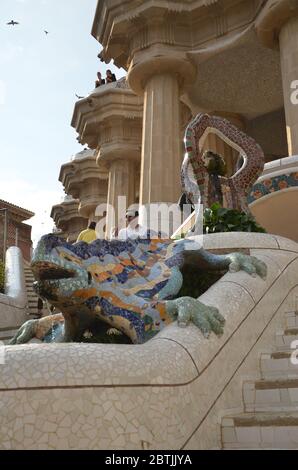 The Park Guell is a public park system composed of gardens and architectonic elements located on Carmel Hill. A famous lizard sculpture fountain. Stock Photo