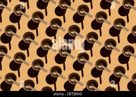 Disposable recyclable tableware, eco tableware with hard shadows on a beige background, pattern of repeating paper cup and spoon Stock Photo