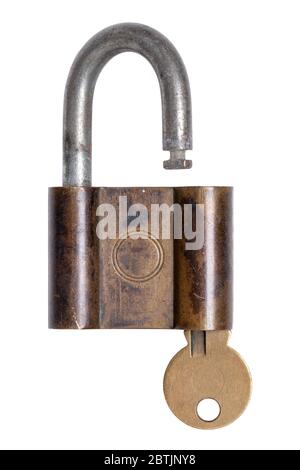 Lock and keys. Closeup of a old opened brass padlock with key inside isolated on a white background. Macro photograph of antique metal lock. Stock Photo