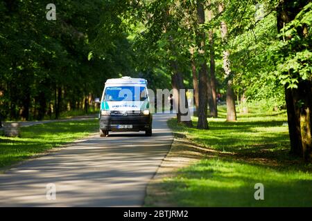 A police vehicle going in the Vingis park in Vilnius, Lithuania Stock Photo