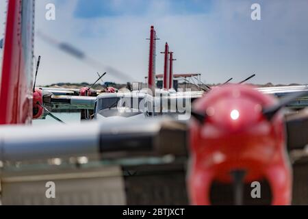 Male, Maldives – May 10, 2019: TMA - Trans Maldivian Airways Twin Otter seaplanes at Male airport (MLE) in the Maldives. Seaplane parking in Male Stock Photo