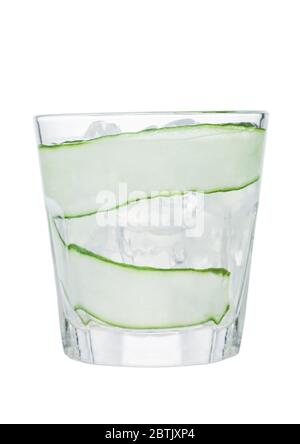 Fresh cold cucumber water with ice cubes and cucumber slices isolated on white background. Healthy and refreshing organic drink. Stock Photo