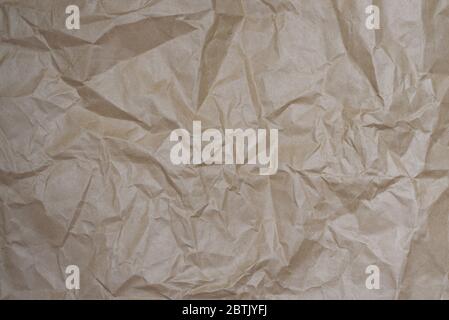 Craft crumpled beige paper for background usage. Eco Zero Waste background. Copy space. Stock Photo