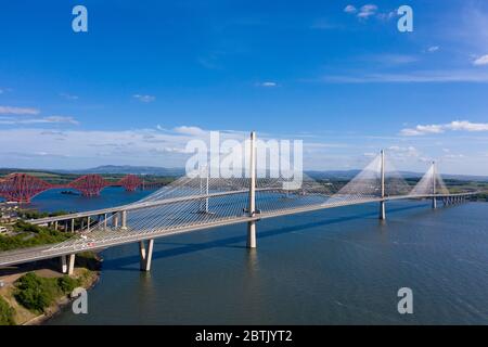 Aerial view of three bridges crossing the River Forth with new Queensferry Crossing in front at North Queensferry, Fife, Scotland, UK