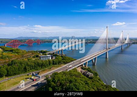 Aerial view of three bridges crossing the River Forth with new Queensferry Crossing in front at North Queensferry, Fife, Scotland, UK