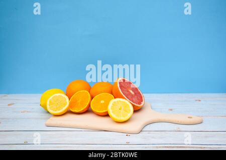 Sliced citrus fruits on the table Stock Photo