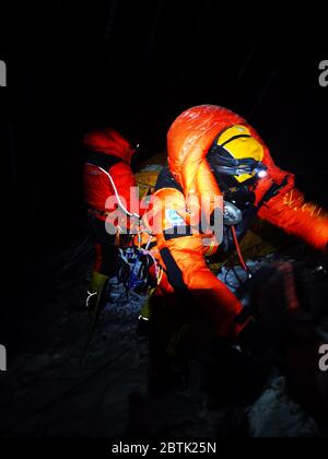 Mount Qomolangma Base Camp. 27th May, 2020. Chinese surveying team prepares before setting off to reach the summit of Mt. Qomolangma, the world's highest peak, from a mountain camp at an altitude of 8,300 meters, on May 27, 2020. Credit: Tashi Tsering/Xinhua/Alamy Live News Stock Photo