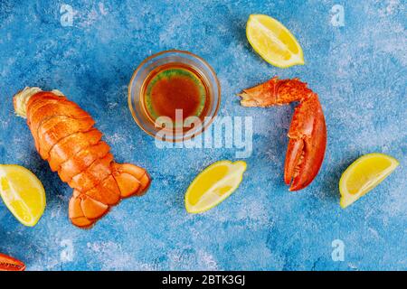 Boiled red claw lobster tail with lemon and butter sauce Stock Photo