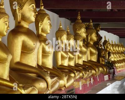 Golden Buddha statues in Wat Phra Si Ratana Mahathat in Phitsanulok Stock Photo