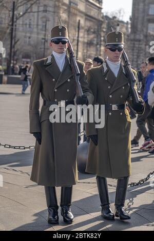 Budapest, Hungary-Feb 8, 2020:Change of guards in uniform with swords in front of Hungarian Parliament in Budapest Stock Photo