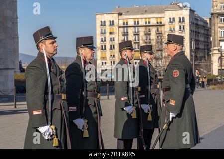 Budapest, Hungary-Feb 8, 2020: Change of guards in uniform with swords in front of Hungarian Parliament in Budapest Stock Photo